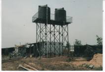 Raised water tank construction for boreholes