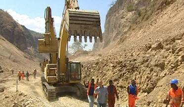 Constructing dams in Africa using heavy equipment